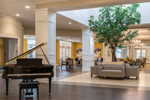 Baby grand piano and open indoor courtyard