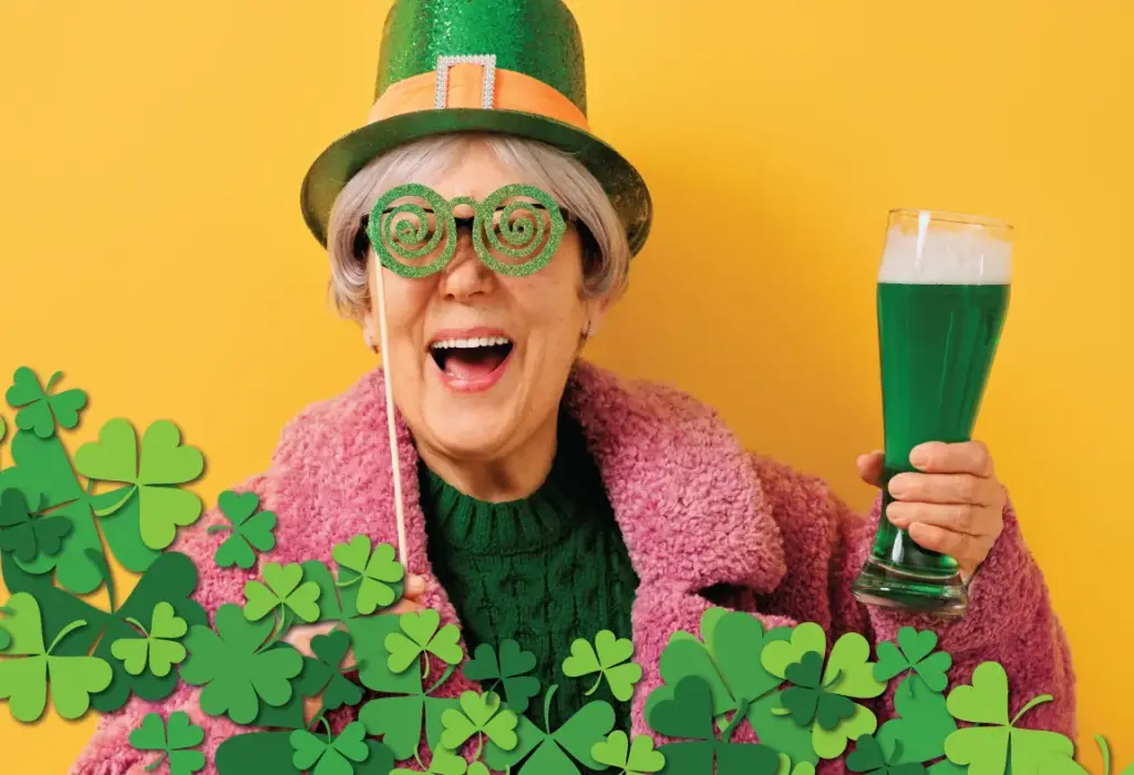 woman with a green beer and St. Patrick's day hat