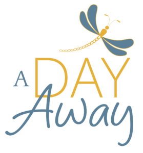 A Day Away logo with Dragon Fly graphic